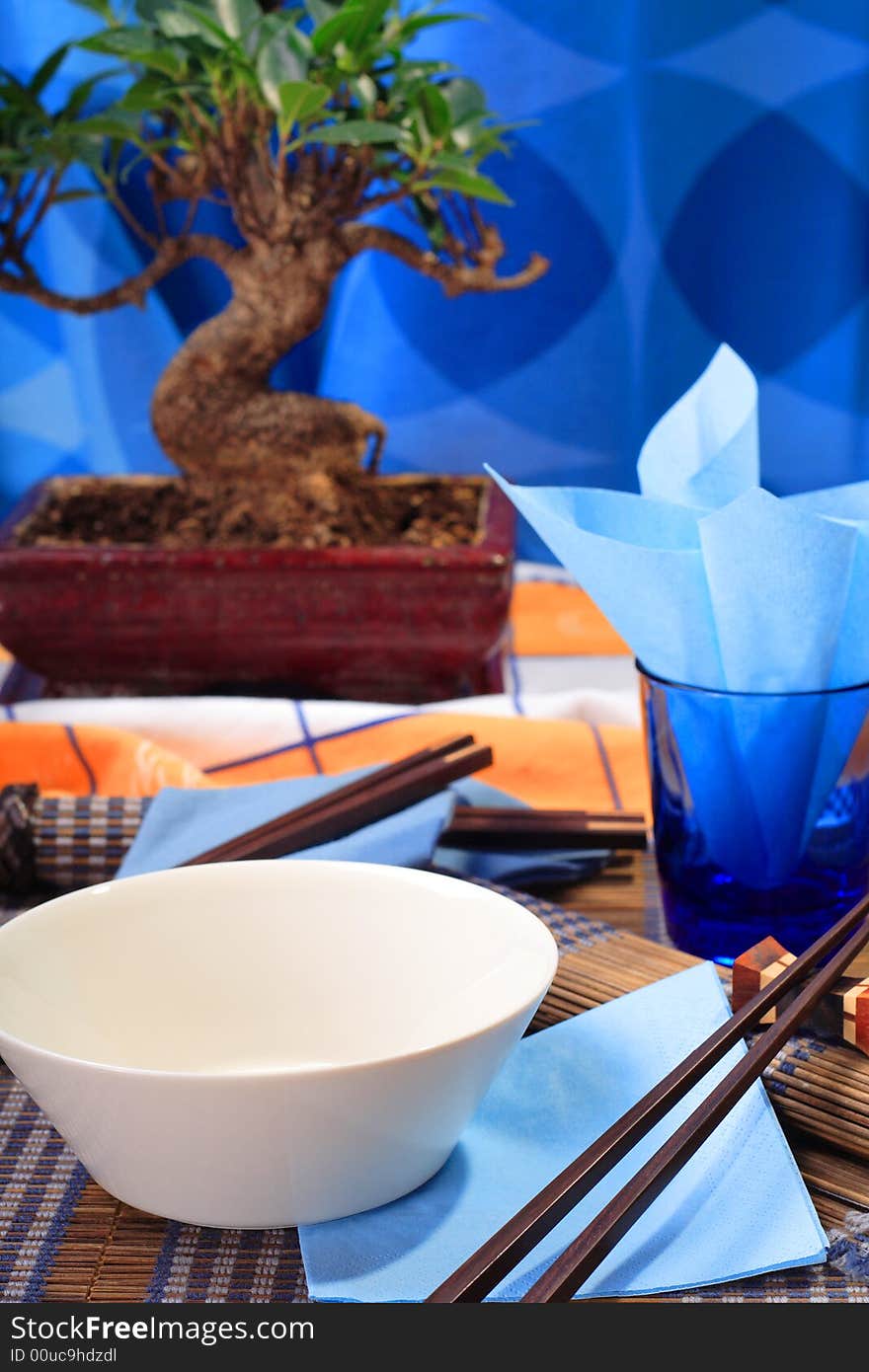 Asian decorated table, soup bowl in the foreground