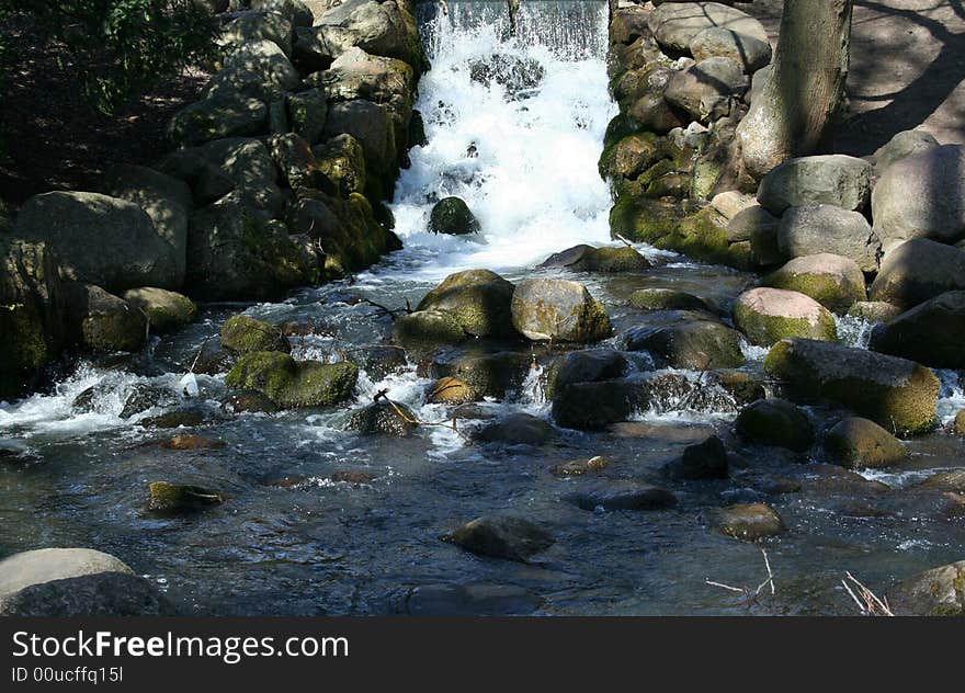 Beautiful waterfall in park on a sunny day