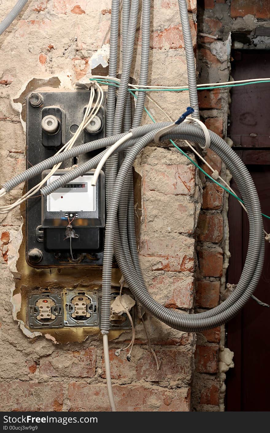 Grungy active energy meter with lots of power cables