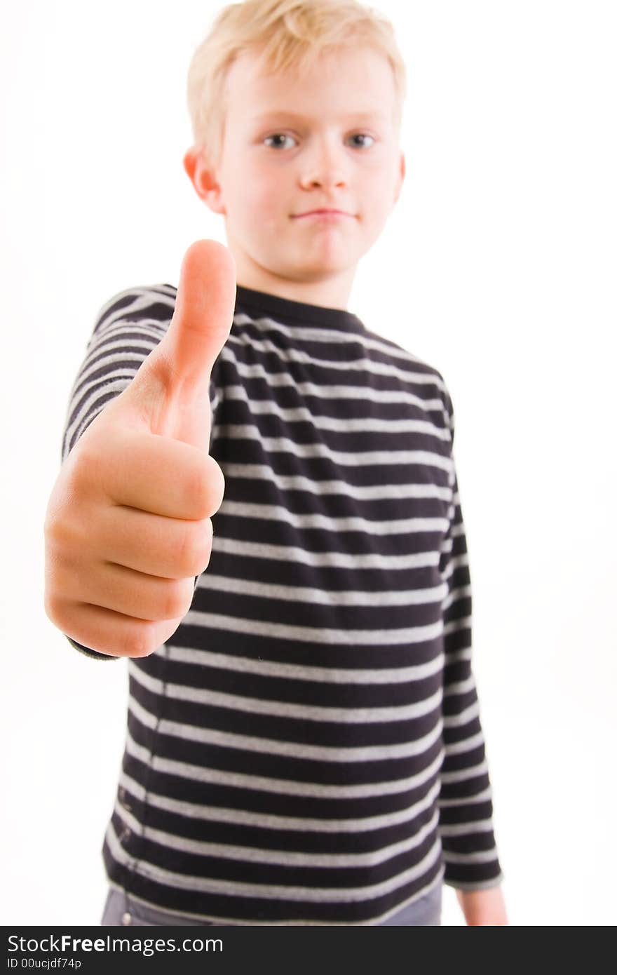 Portrait of a smiling little boy, thumbs up