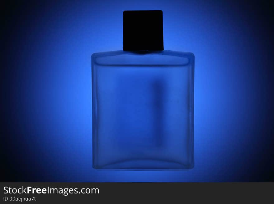 Generic perfumes flask over blue background