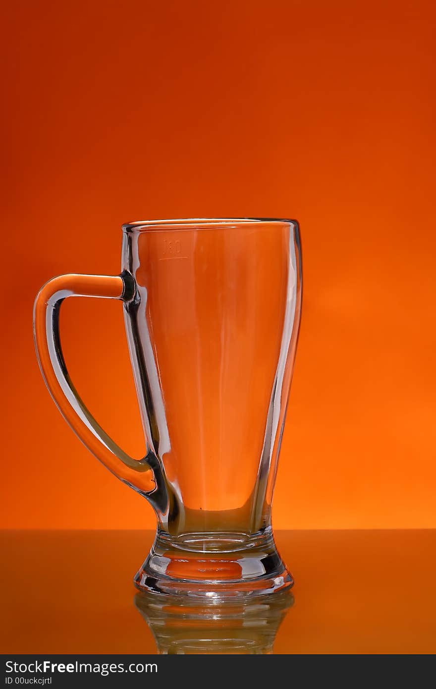 Empty mug over orange background. Empty mug over orange background