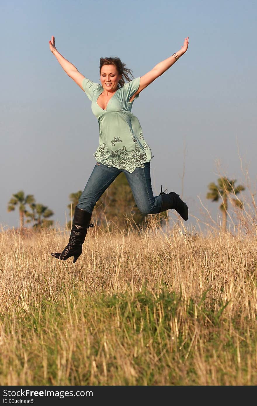 Jumping girl  autumn jeans outdoors