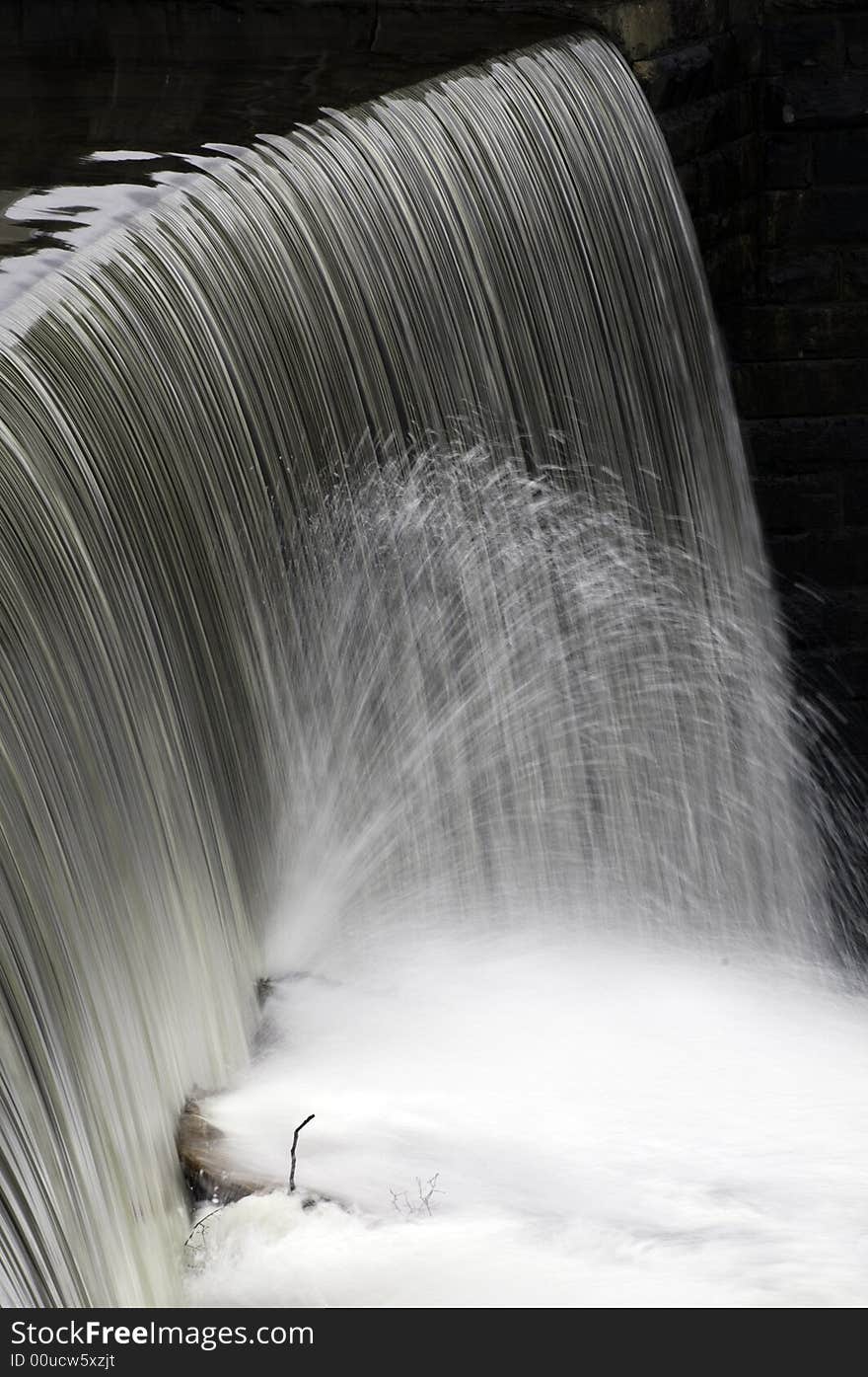 Water pours over spillway at Barden Reservoir. Water pours over spillway at Barden Reservoir