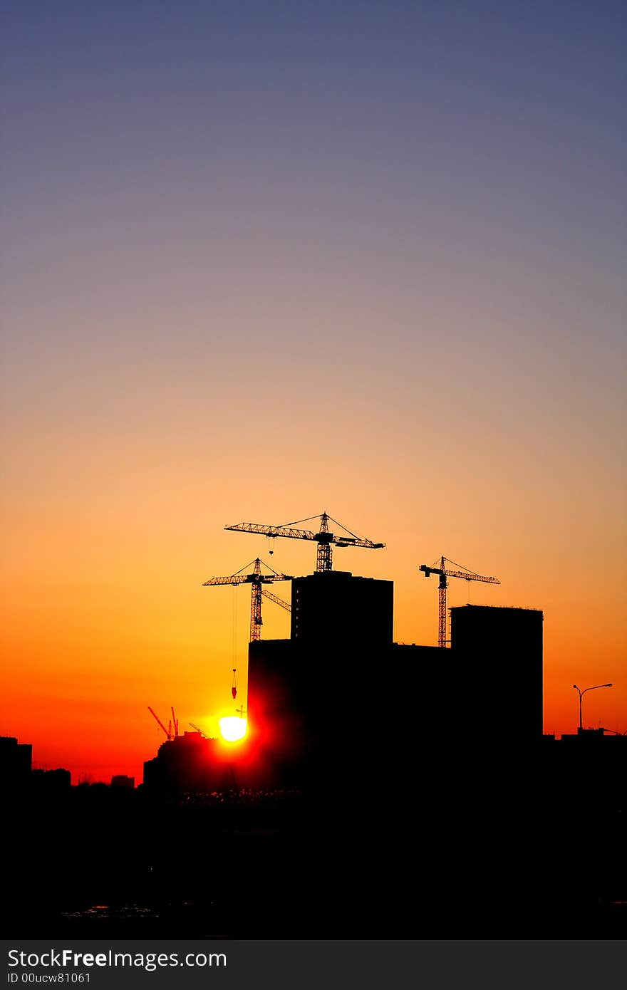 Construction of a major housing project at sunset. Construction of a major housing project at sunset.