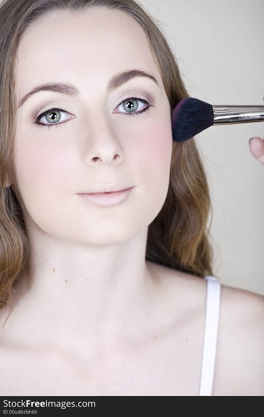 Make-up blush on young woman