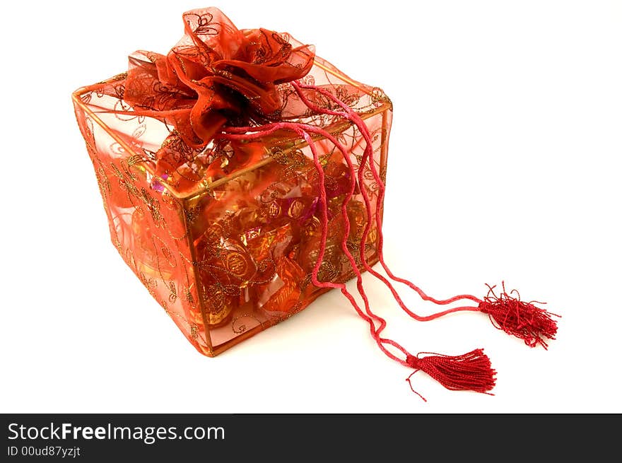 Red gift box with red bow on a white background