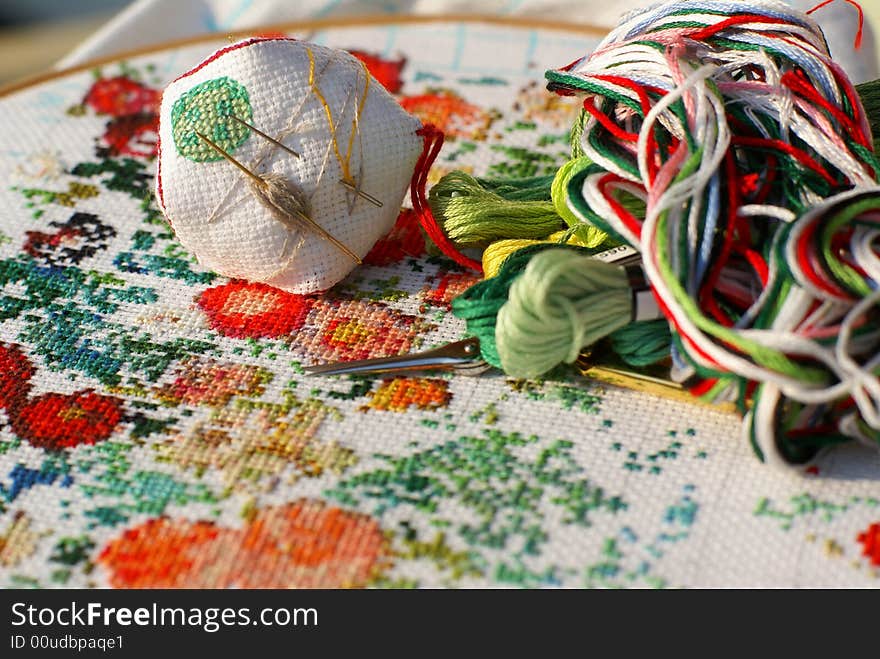 Generic flowers on textile (cross stitch). Generic flowers on textile (cross stitch)