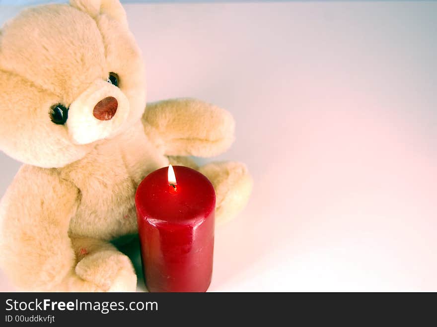 Bear and burning candle