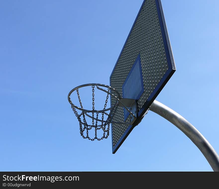 Steel basket to basket-ball on blue sky