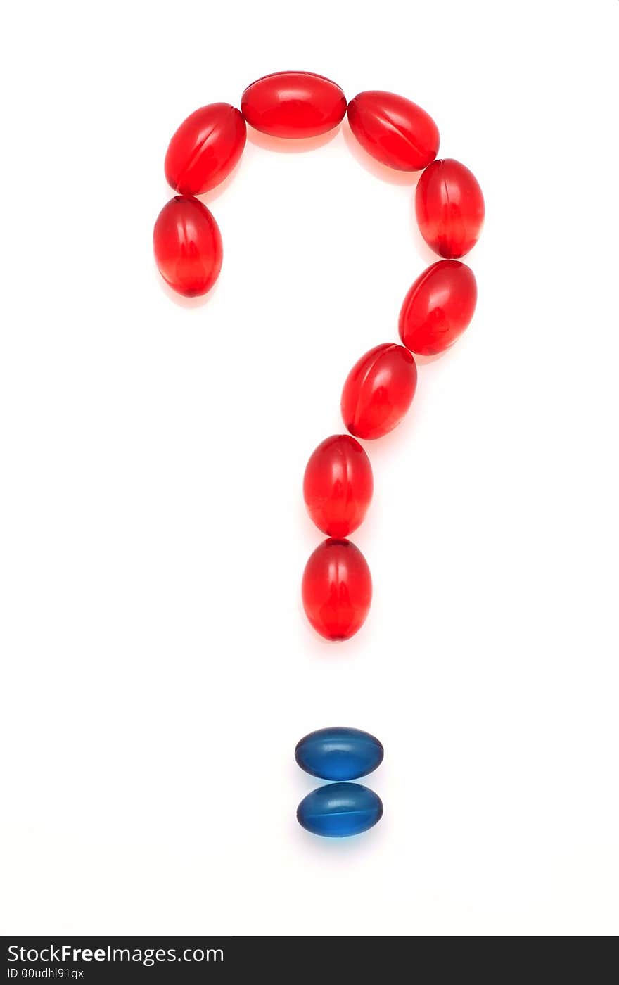 Question mark made of red and blue capsules on white background. Question mark made of red and blue capsules on white background