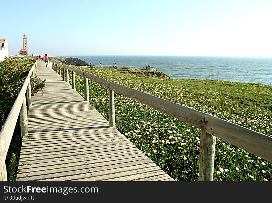 Wood way in park near lighthouse in portuguese coast