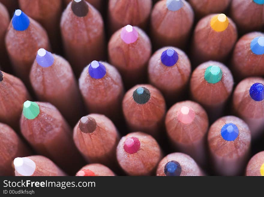 Full frame view of coloured pencils in pot