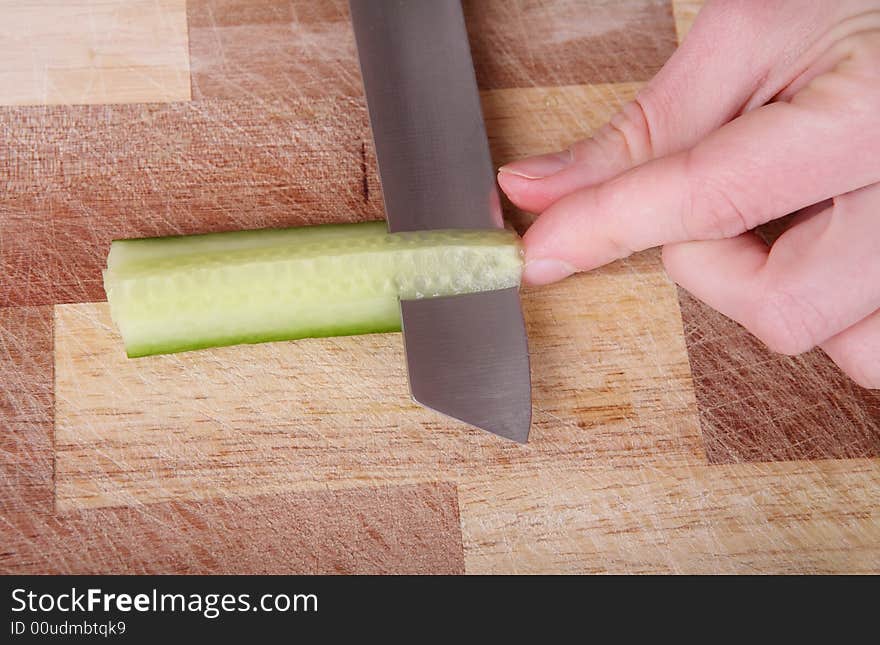 Cutting the cucumber with a knife