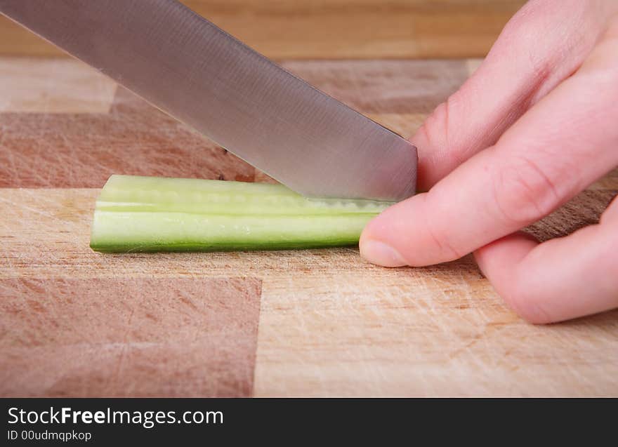 Cutting the cucumber with a knife