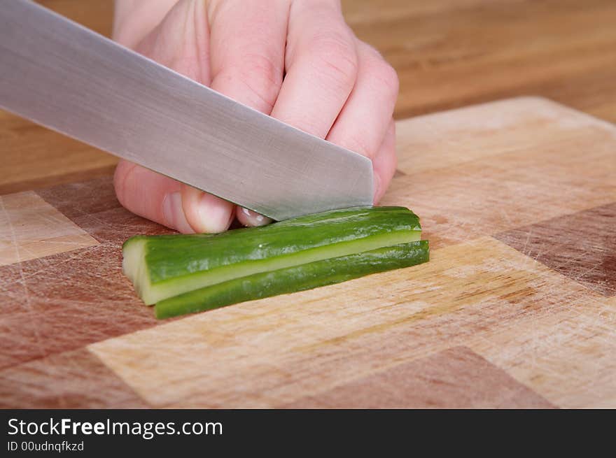 Cutting the cucumber with a knife