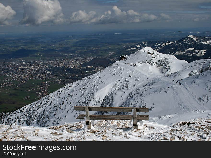 Wooden bench on mountain top over Salzburg city. Wooden bench on mountain top over Salzburg city.