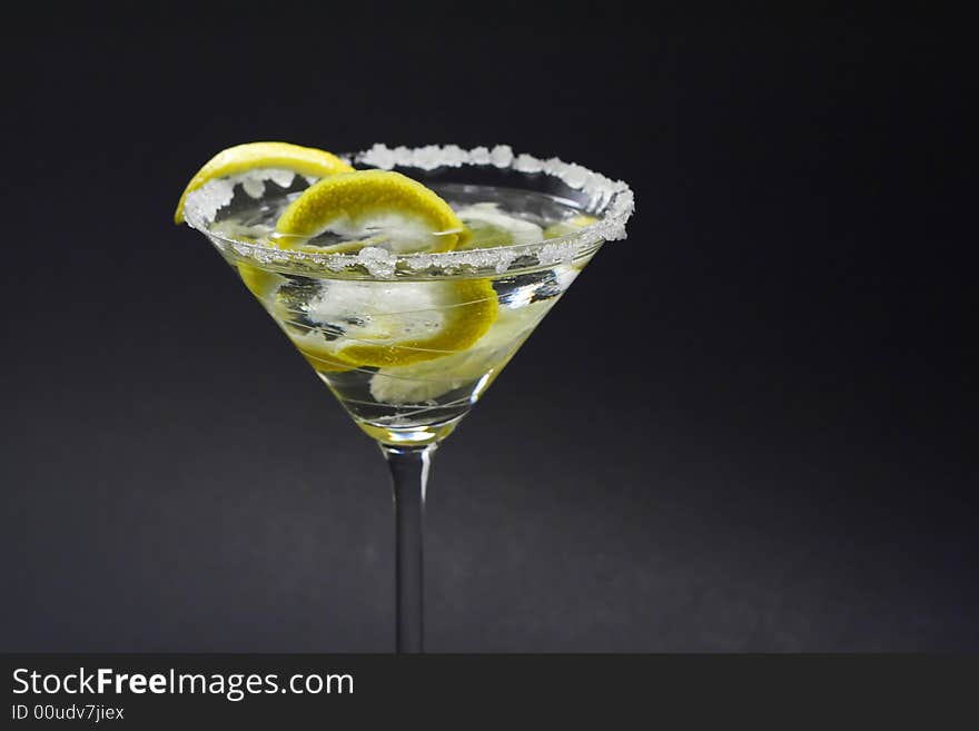 Martini with sugar crust, lemon and peels