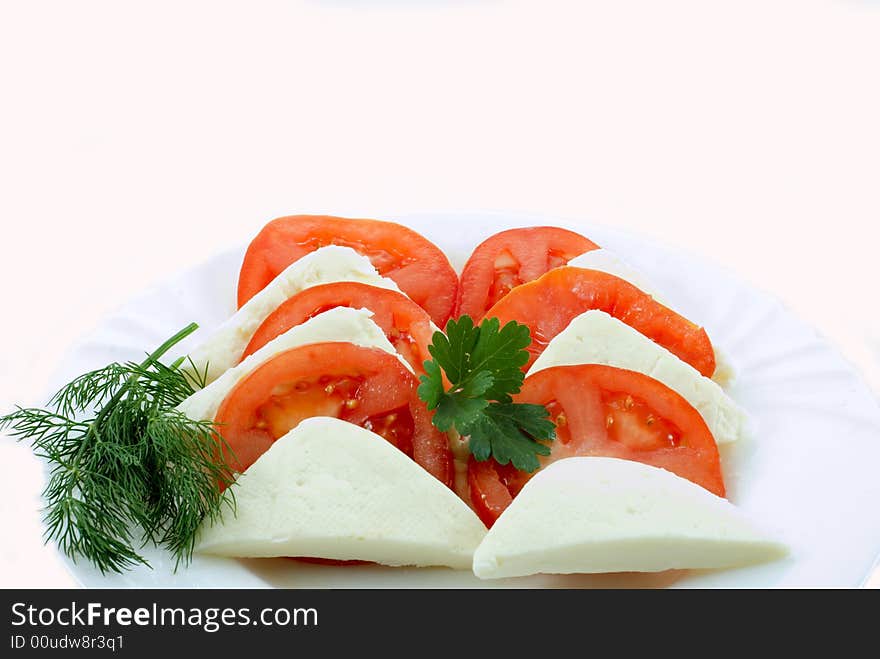 Tomato and slice on white background. Tomato and slice on white background