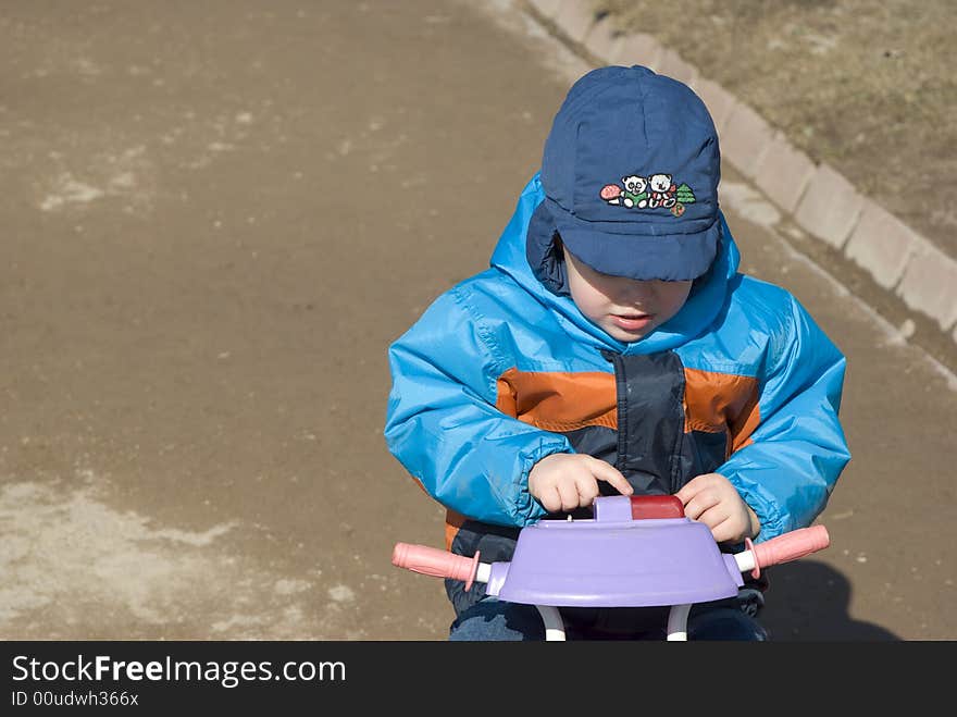 Little Boy On The Tricycle