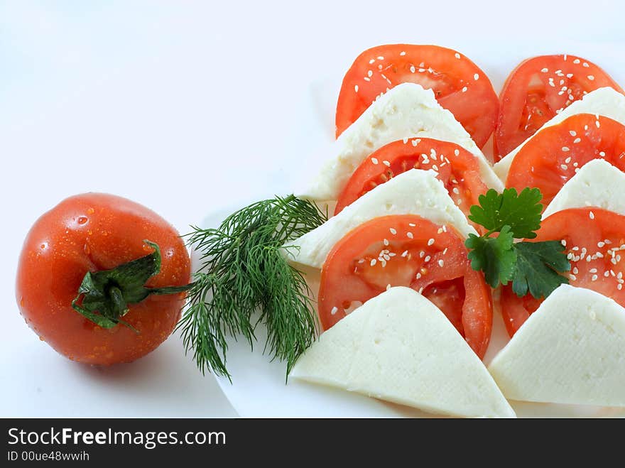 Tomato and slice on white background. Tomato and slice on white background