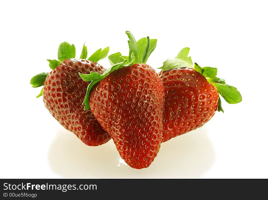 Tree fresch ripe strawberries over white background