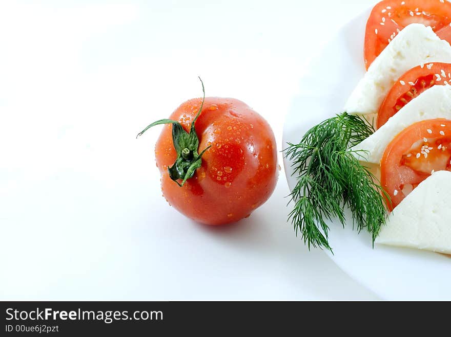 Tomato and slice on white background. Tomato and slice on white background