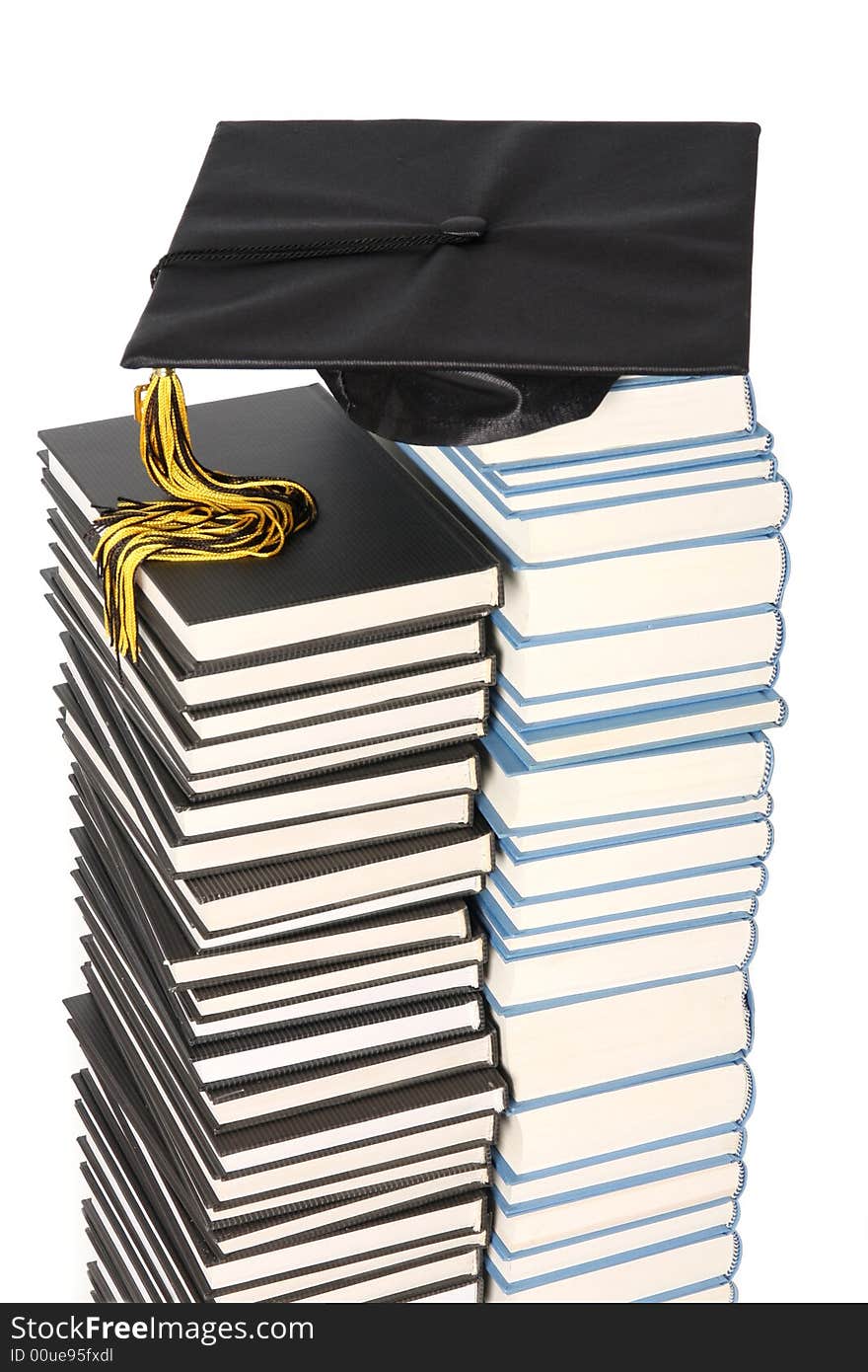 Graduation cap and books on white background