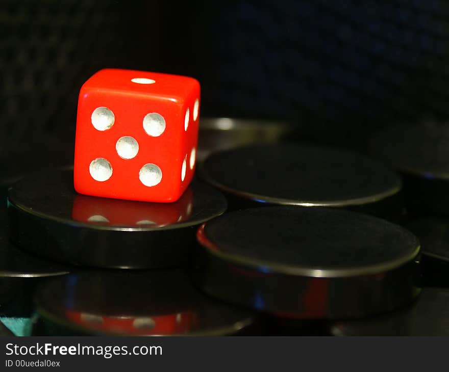 A cube used to play backgammon game. A cube used to play backgammon game