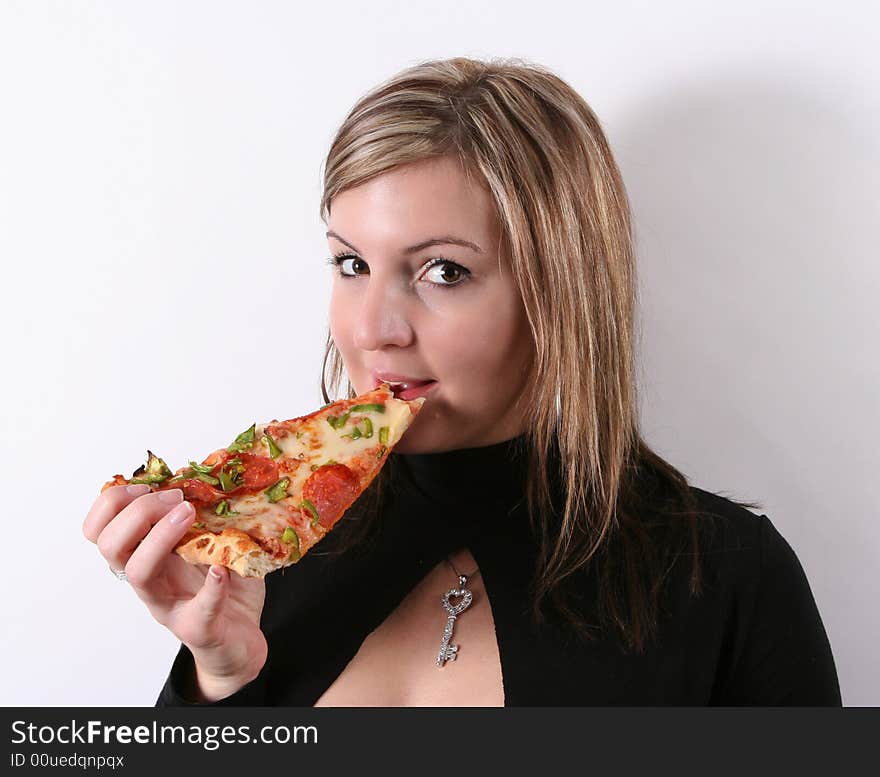 girl eating pizza slice