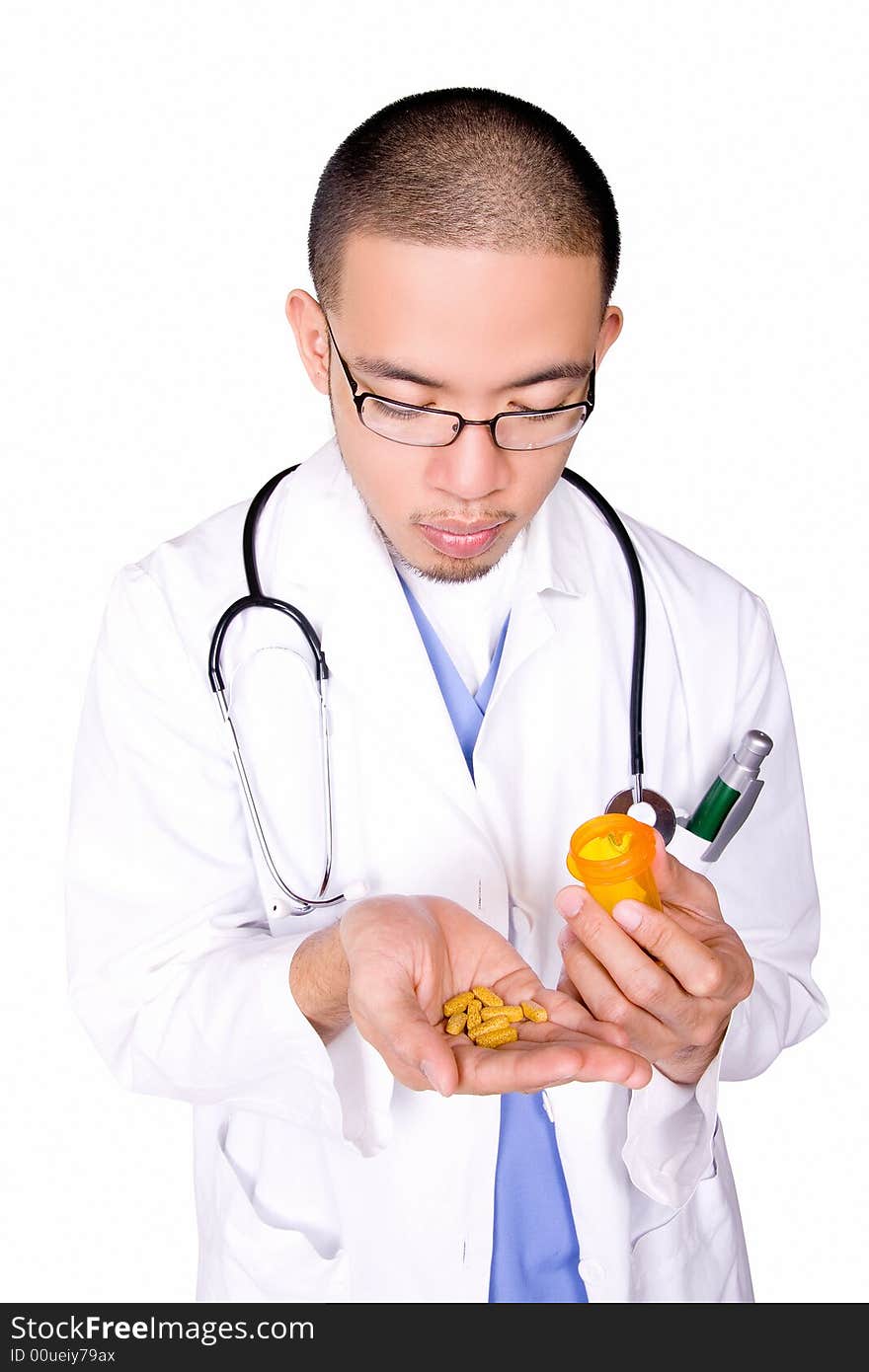 Male nurse counting pills to give to patient.