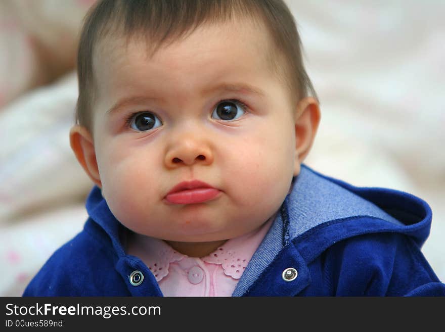 Face of the small baby girl, short hair