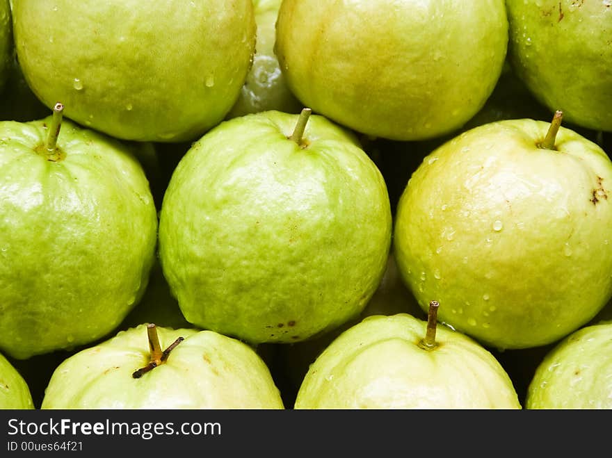 A row of guava fruit for sale