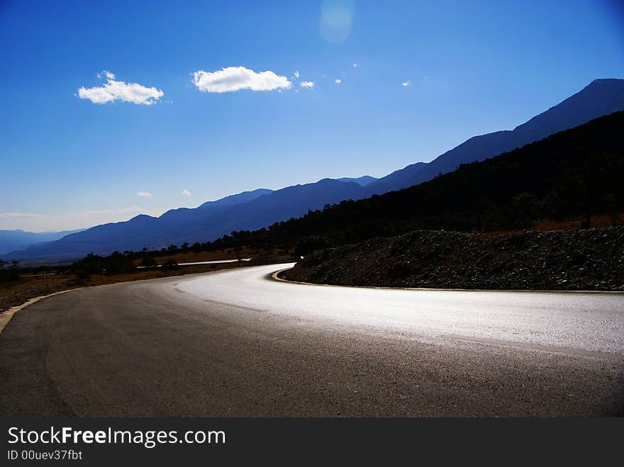 Road down to the Yulong Snow Mountain. Road down to the Yulong Snow Mountain