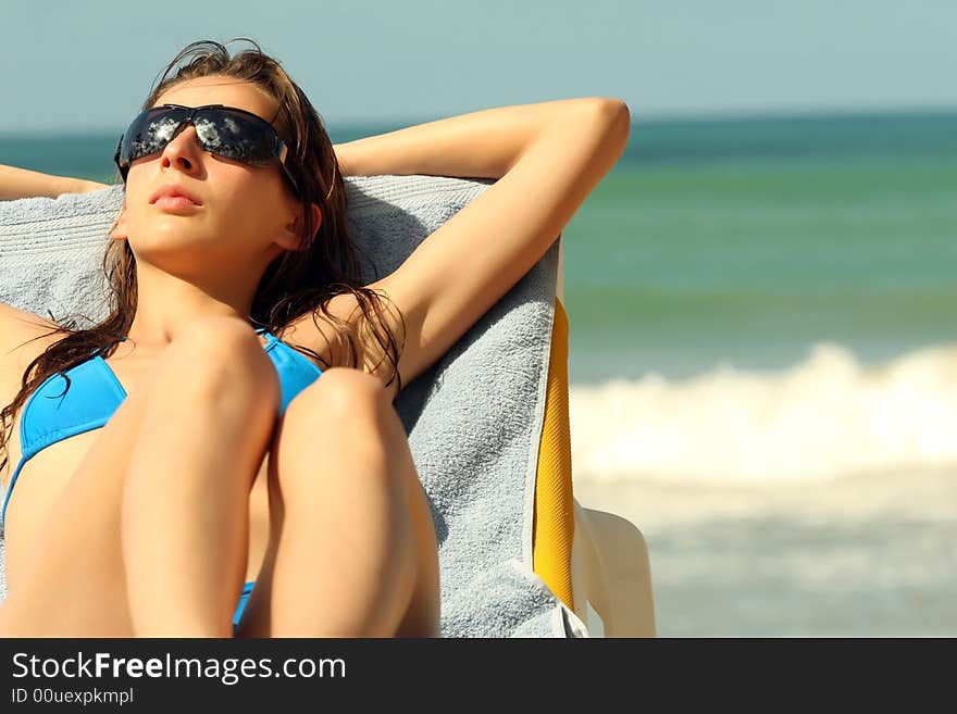 Sunbathing On The Beach