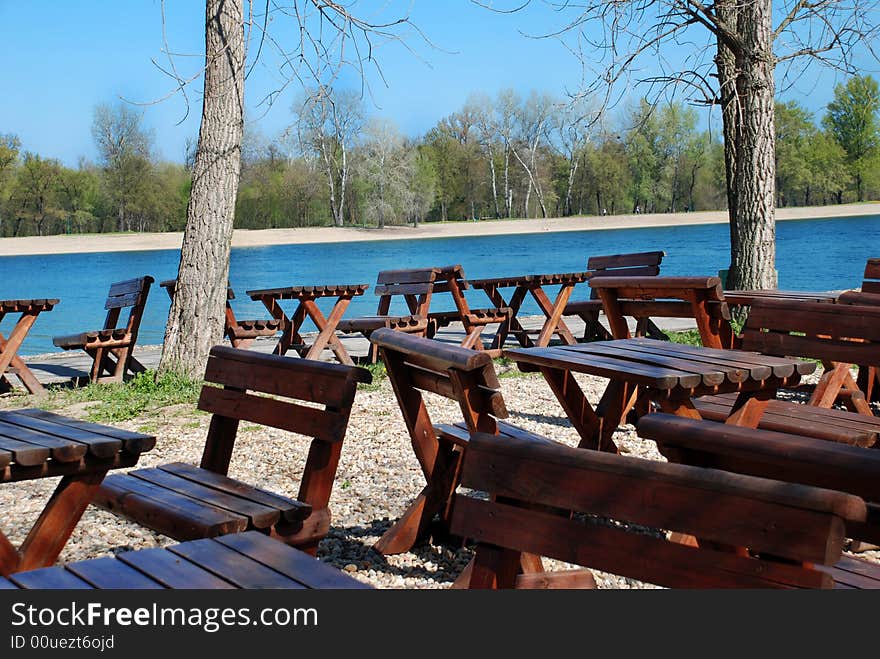 Wooden Tables In Park