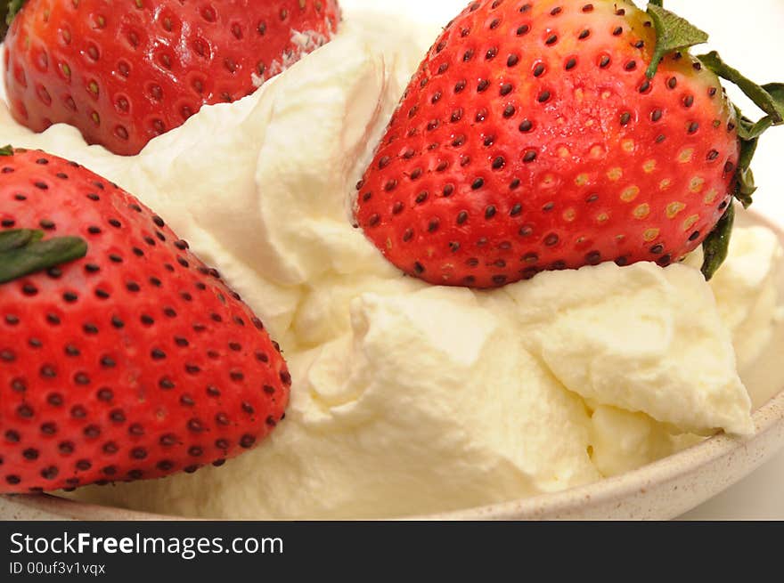 Strawberry with the cream, isolated on a white background