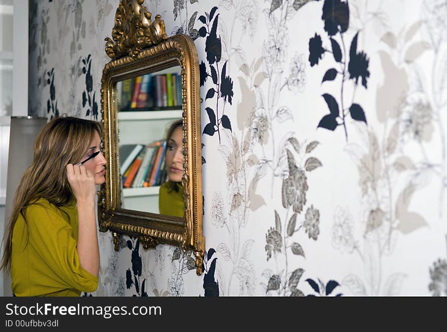 Woman applying cosmetic with applicator. Make-up treatment. Woman applying cosmetic with applicator. Make-up treatment.