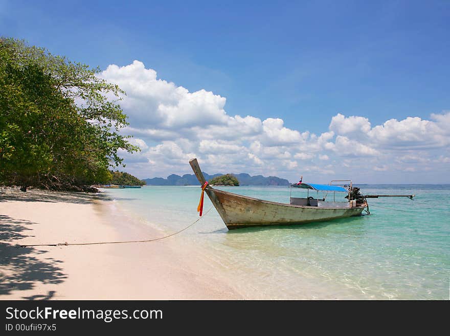 Beautiful longtail boat on the sand seashore. Beautiful longtail boat on the sand seashore