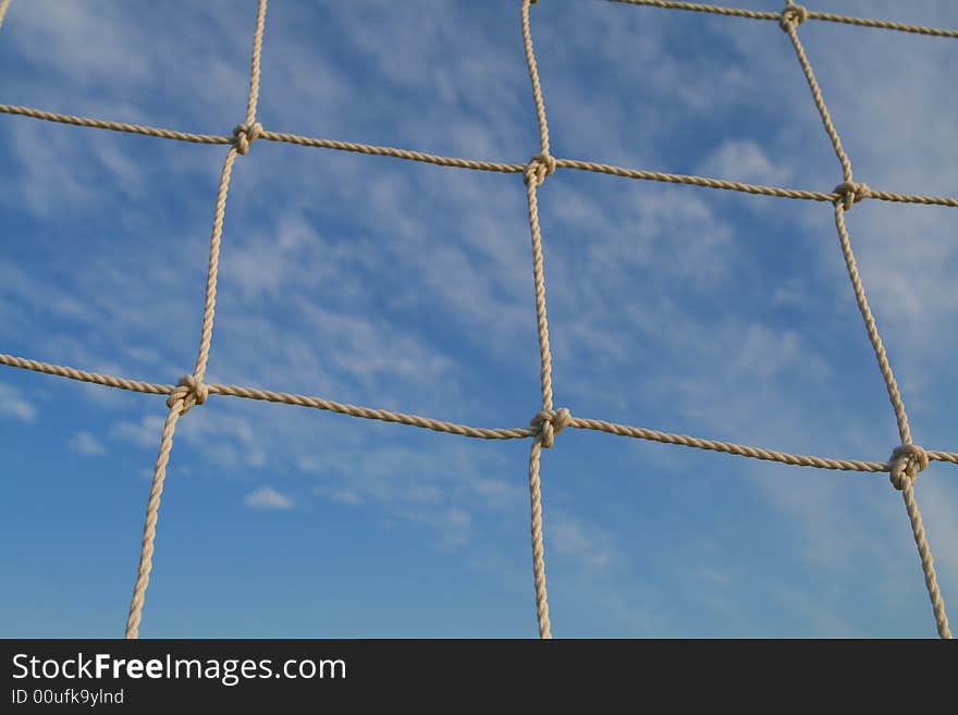 Soccer net with a blue sky background