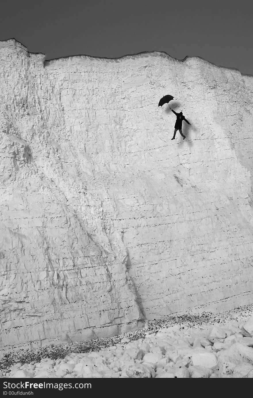 Abstract - a man with top hat and umbrella flying down from the cliffs..
Please check for similar. Abstract - a man with top hat and umbrella flying down from the cliffs..
Please check for similar