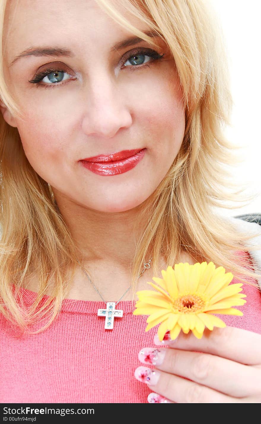 Portrait of beautiful young woman with yellow flower. Portrait of beautiful young woman with yellow flower