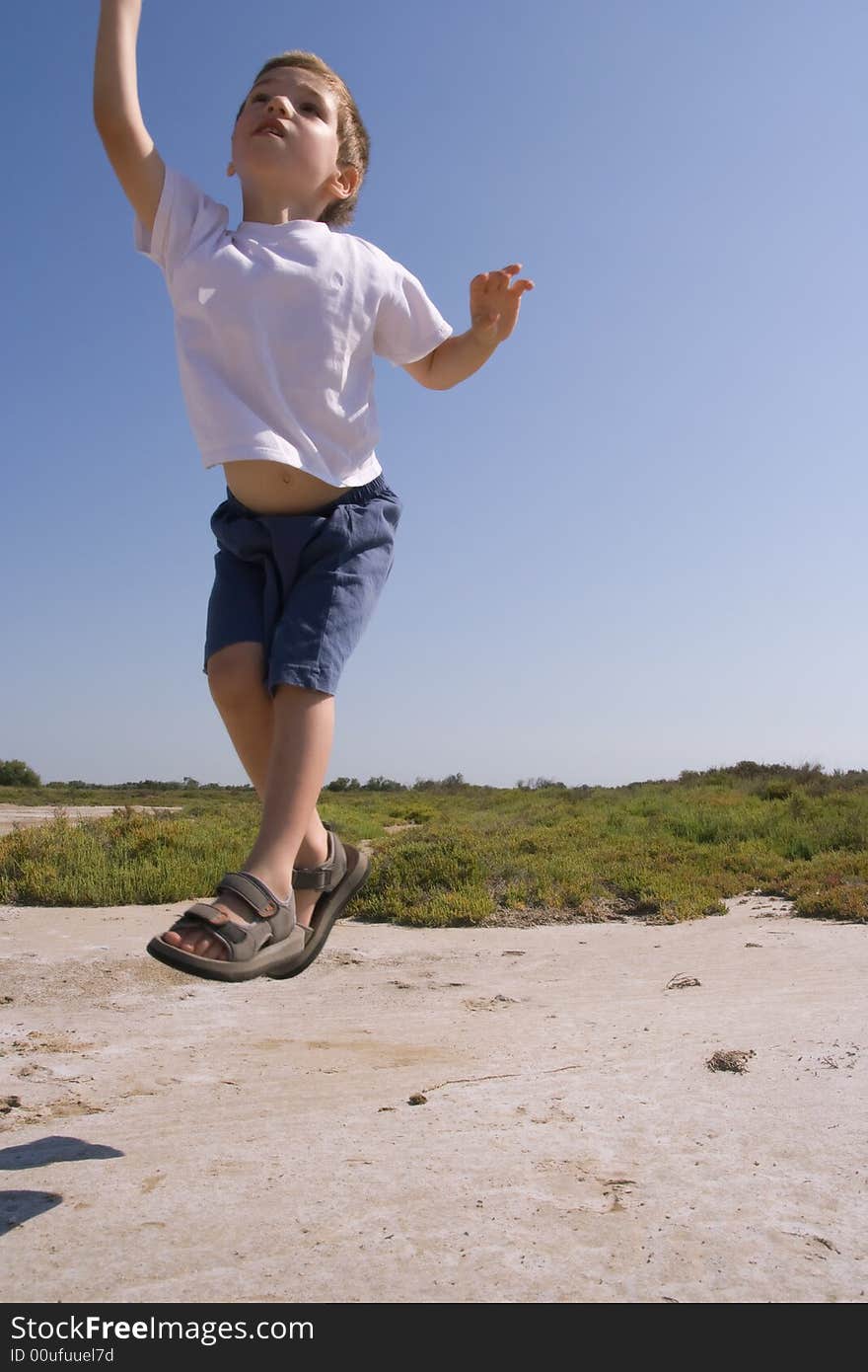 A child jumping in the nature. A child jumping in the nature