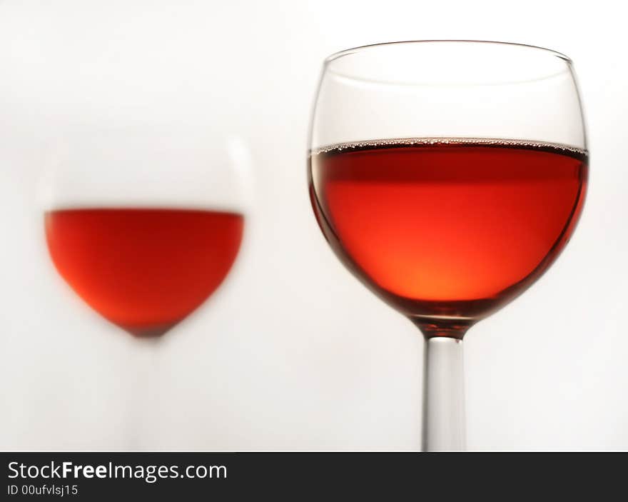 Two glasses of a red wine, close up with selective focus