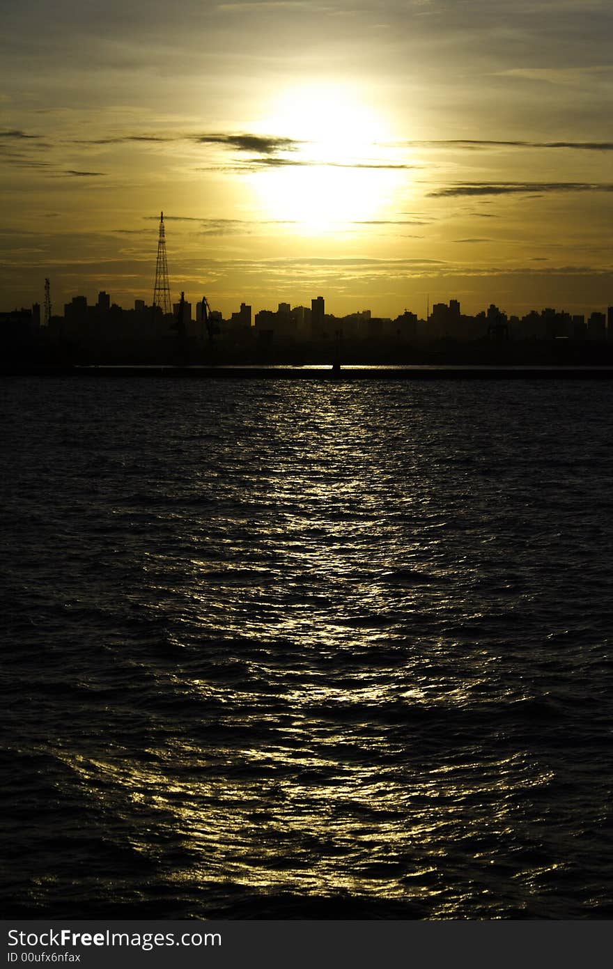 Sunset near city with blue sky.