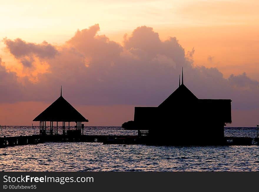 Tropical resort against the sunset