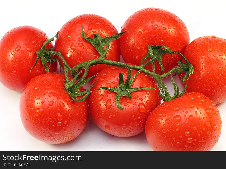 Tomato, branch, red, wet, a vegetable, vitamins, water, meal, food. Tomato, branch, red, wet, a vegetable, vitamins, water, meal, food