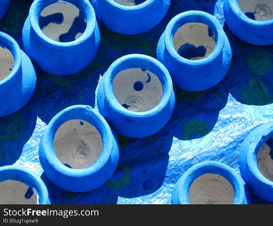 Blue pots kept under the direct sunlight. Blue pots kept under the direct sunlight