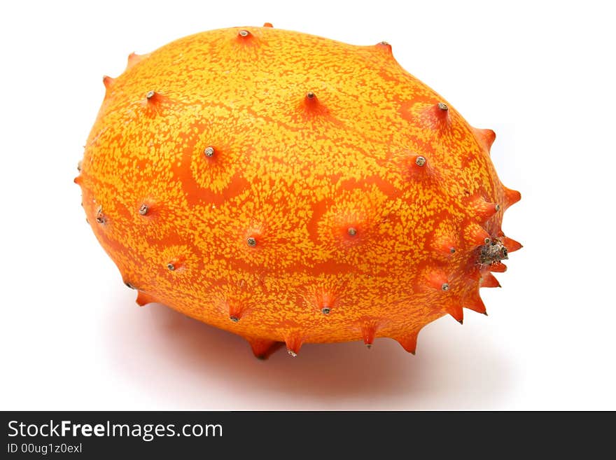 Kiwano or African horned melon sliced open over white. Also known as hedged gourd, African Horned Cucumber, English tomato.