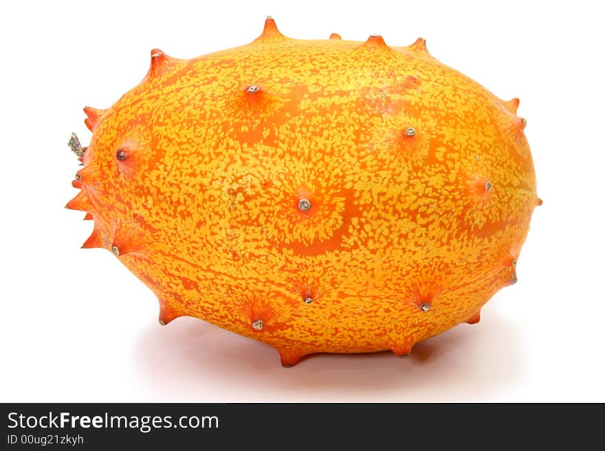 Kiwano or African horned melon sliced open over white. Also known as hedged gourd, African Horned Cucumber, English tomato.